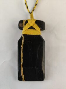 Pounamu with yellow braided necklace
